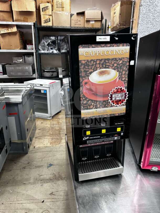 Wilbur Curtis cappuccino dispenser, model PC-3D-10-01, offers 3 flavor stations. Excellent condition, 120V, fully tested.