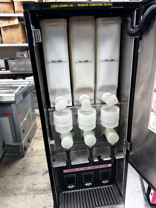 Wilbur Curtis PC-3D-10-01 cappuccino dispenser, 3 flavor stations, excellent condition, operational, includes fill line markings.