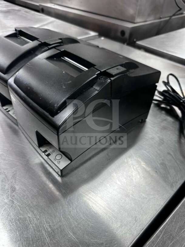 Star Micronics SP700/SP742 impact printers, black, prime condition, fully tested, 100-240V, quantity 2, shown on metallic surface.