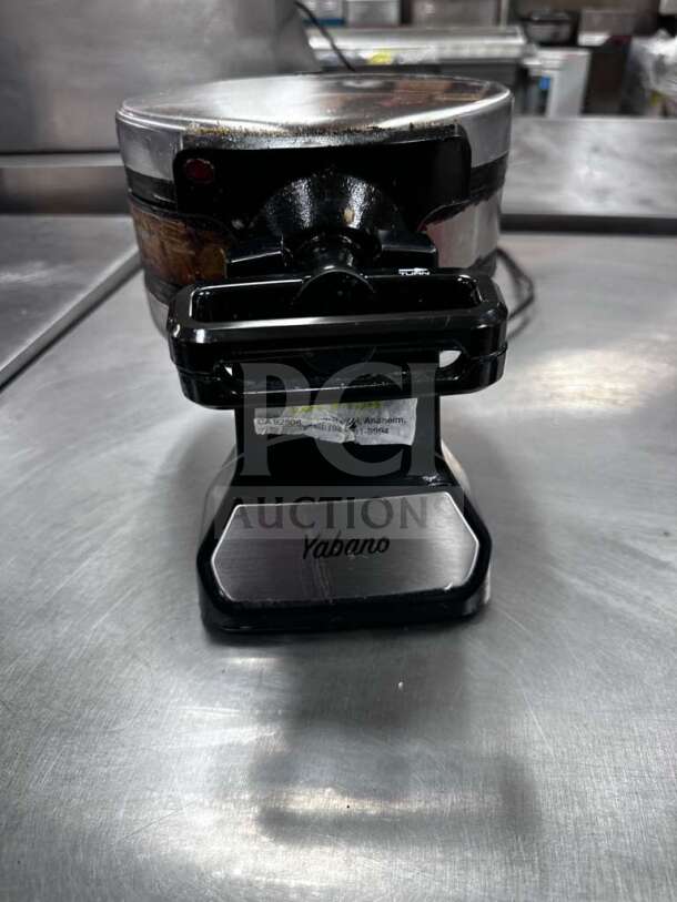 Yabano SW-290B Belgian waffle maker, rotating design, 1200W, ETL listed, fully tested. Black and silver finish, visible Yabano branding.