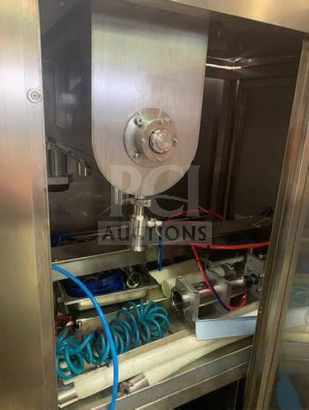 TANG Two-Head Automatic Filling Machine, model TAN-L-FIL-0423, premium condition, stainless steel, fully operational.