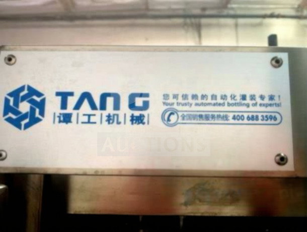 TANG Two-Head Automatic Filling System in premium condition, precision volume filler for sauces and liquids with visible branding.