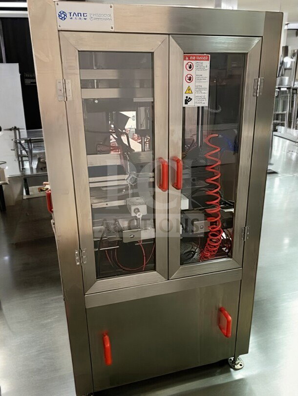 Tang Machinery Four-Station Semi-Automatic Vacuum Capping Machine in premium condition. Secure vacuum-seal, fully tested. Model TNG-L-CAP-0424.