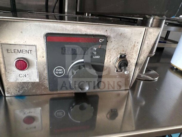 Keating Miraclean® 36" gas griddle control panel. Visible element light, temperature knob, and on/off switch.