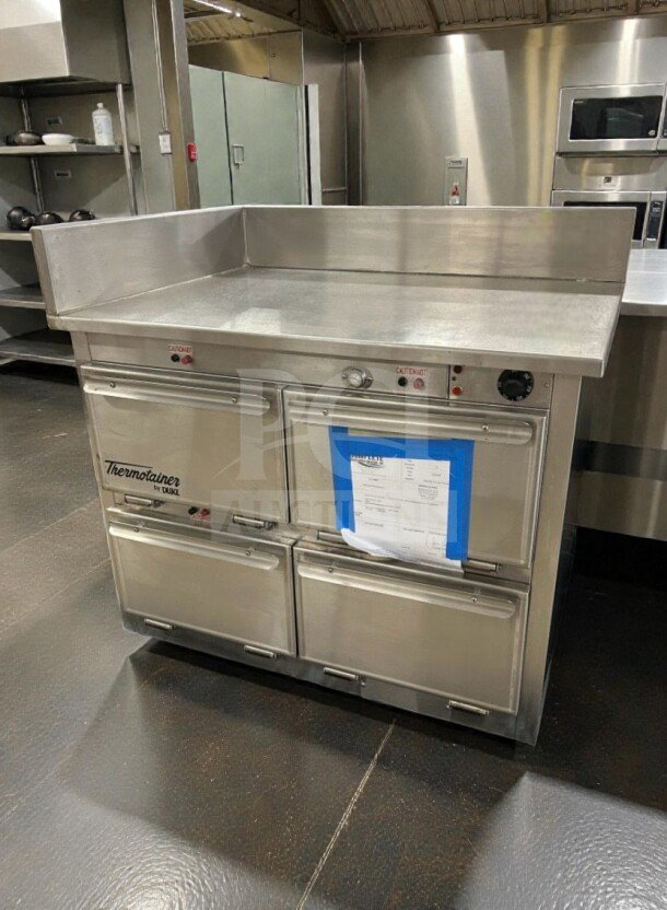 Duke Thermotainer Heated Holding Cabinet in excellent condition, 208V/3 Phase, fully tested. Stainless steel with control panel.