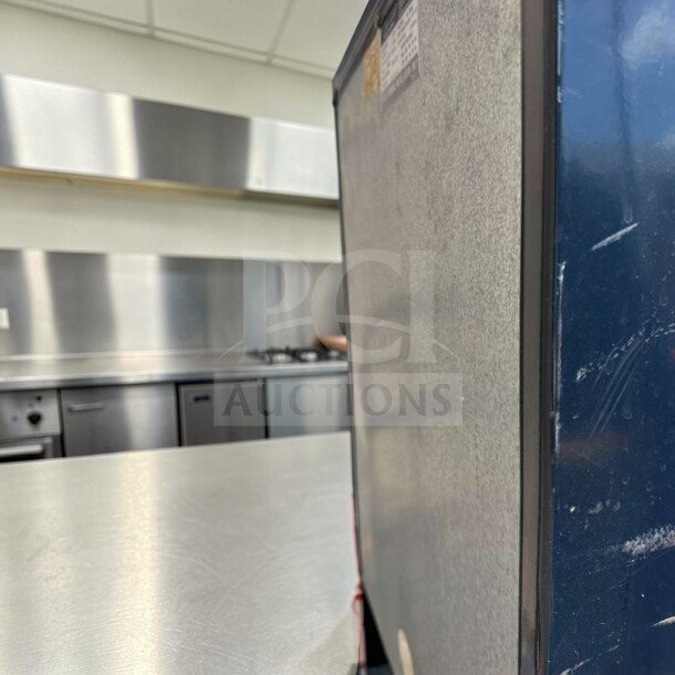 Euro-Gold W-995 undercounter refrigerator, space-saving mini fridge, fully operational, visible label for 115V power specification.