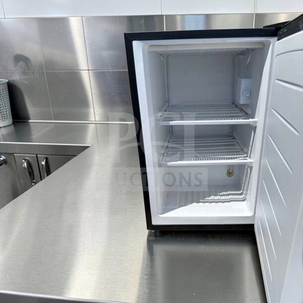 Magic Chef MCUF3S2 3 Cu. Ft. Compact Upright Refrigerator, stainless steel, excellent condition, interior view with two shelves.