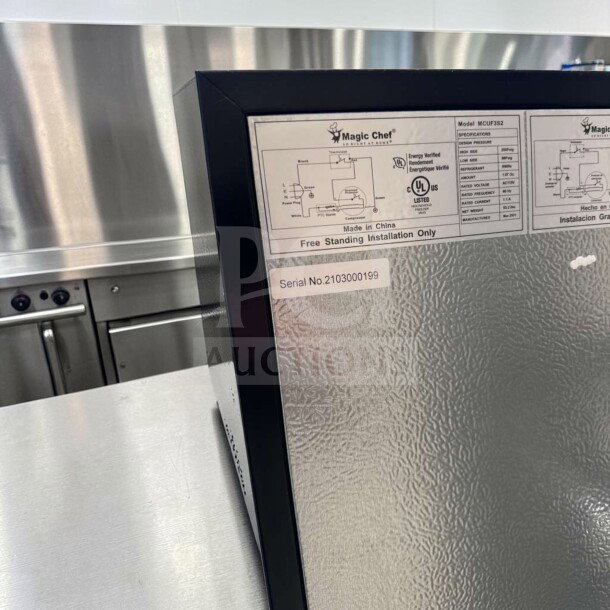 Magic Chef MCUF3S2 compact upright fridge, stainless steel, excellent condition. Label shows model and serial no. 2103000199.