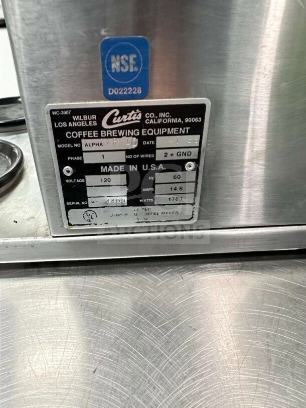 Wilbur Curtis Alpha AP-1D coffee brewer, NSF certified, 120V, pristine condition. Model and specs label visible.
