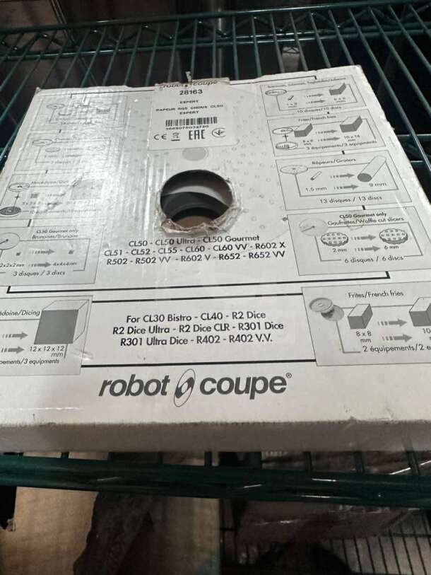 Brand new Robot Coupe 28163 RG5 grating disc in box, for commercial food processors. Box shows compatible models and instructions.