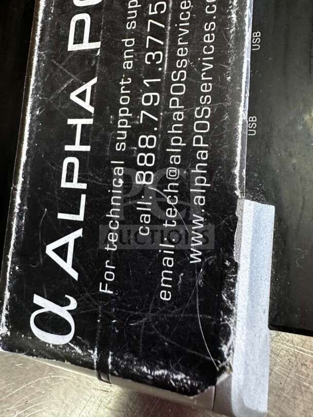 Box for Pioneering DASH10EA 10.1" tablet PC. AlphaPOS technical support details visible. USB ports labeled.