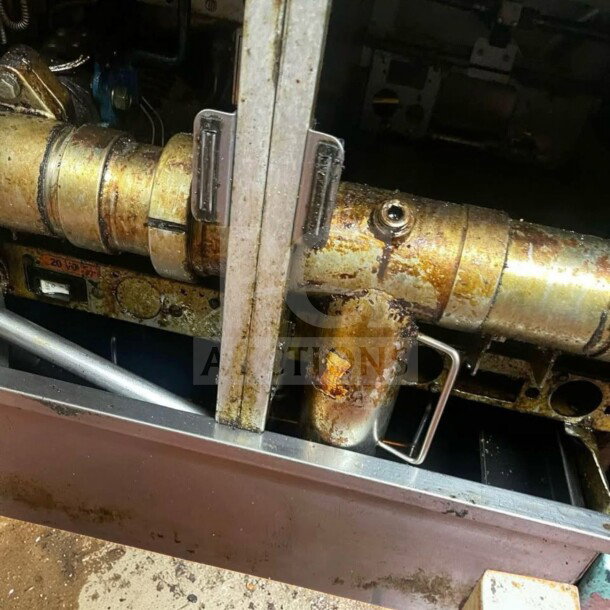 Pitco SSH55 commercial gas fryer battery pipe detail, showing natural gas connections and built-in filtration components.