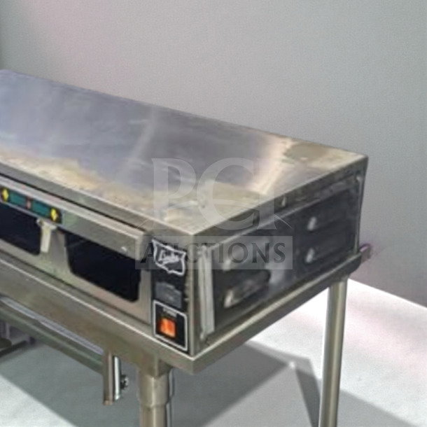 Duke FWM3-14-208 stainless steel heated holding cabinet, superior condition, 208V, fully tested, visible control panel, durable design.