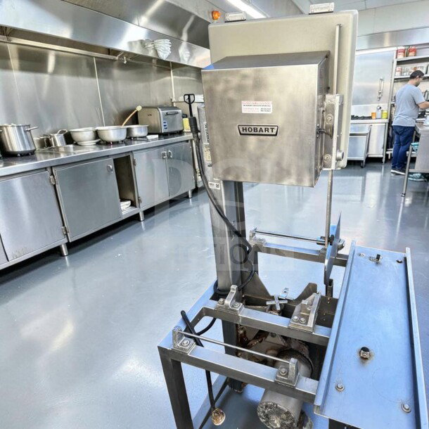 Hobart 5701D Commercial Meat Saw in superior condition, 3 HP, 3 phase, heavy-duty, fully operational, labeled with Hobart branding.