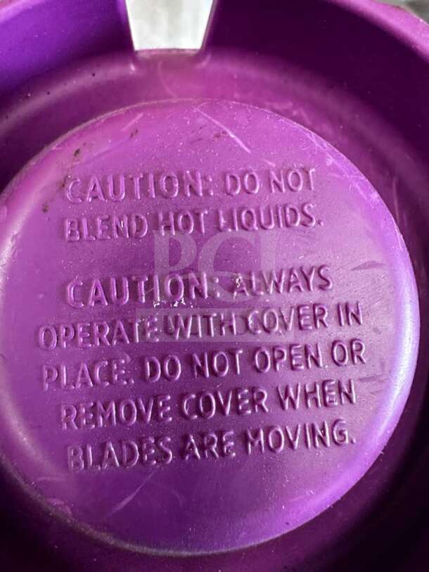 Vitamix Commercial Blender Jar lid, caution text: "Do not blend hot liquids. Operate with cover in place; do not open during use."