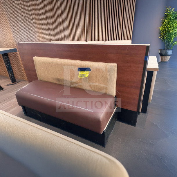 Commercial restaurant booth seating bench with wood back panel, upholstered in brown and beige, in immaculate condition.
