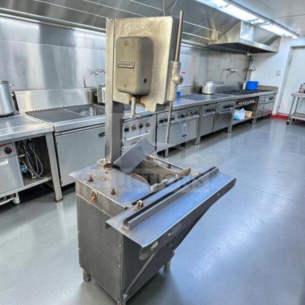 Hobart 5614 commercial meat saw, 2 HP, 3 phase, heavy-duty, shown in a kitchen, for parts or repair. Model HOB-L-MSAW-0946.