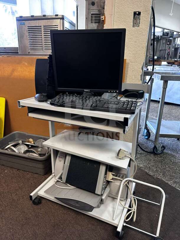 Dell multi-component computer workstation system including monitor, speakers, printer, and audio interface, fully operational.