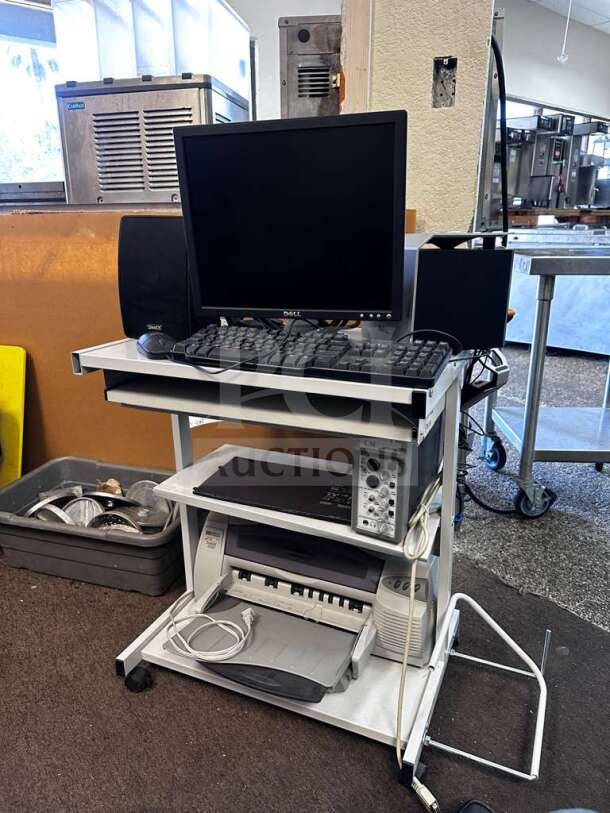 Dell multi-component workstation bundle with monitor, speakers, printer, and audio interface on a mobile cart. Fully tested, operational.