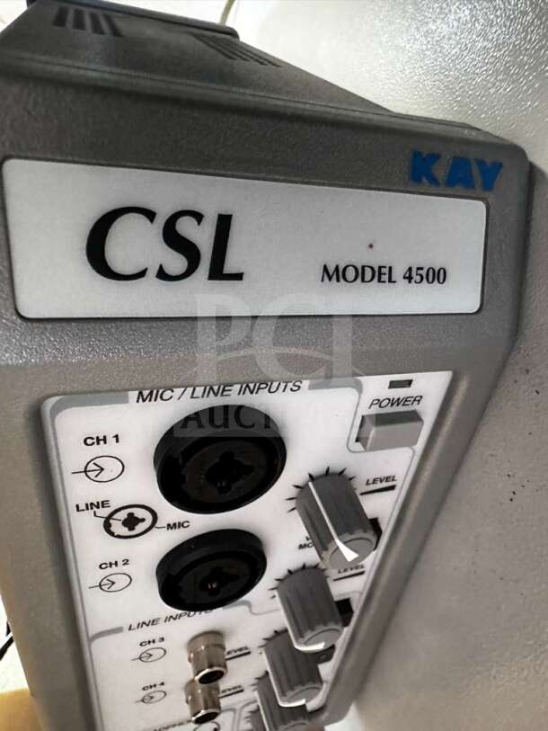 Audio interface close-up showing CSL Model 4500 by KAY, with mic and line inputs, volume knobs, and power button.
