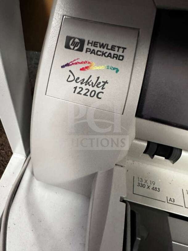 HP DeskJet 1220C printer from Dell Multi-Component Workstation, showcasing logo and paper size guide. Fully functional.