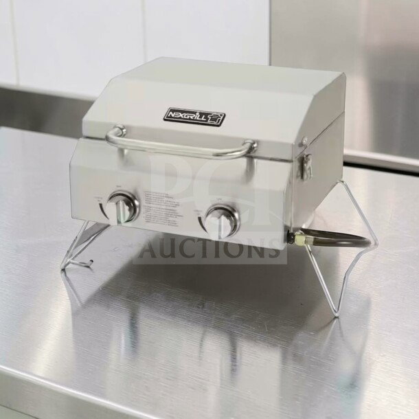Nexgrill 2-Burner Portable Propane Grill, stainless steel, model 820-0033. Superior condition, compact, fully operational.