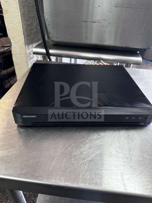 Hikvision DS-7216HQI-K2 DVR, 16-Channel TurboHD, elite condition, fully tested, black casing, front panel controls visible.