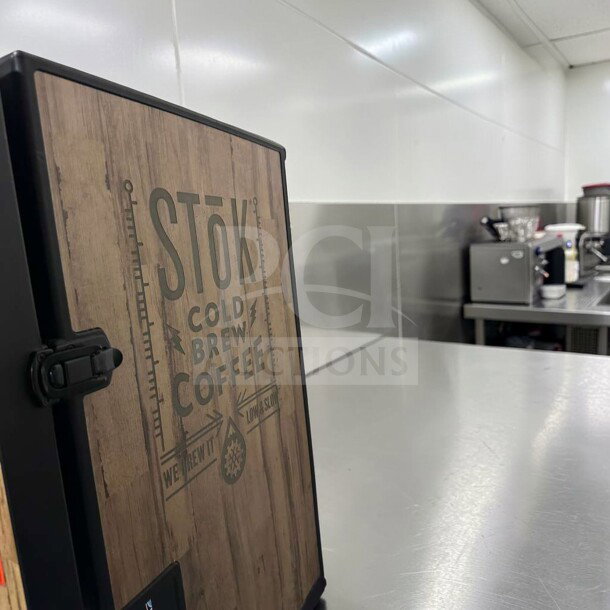 CreaMiser Model 230 cold brew coffee dispenser, dual tap, refrigerated, labeled "SToK Cold Brew Coffee," in exceptional condition.