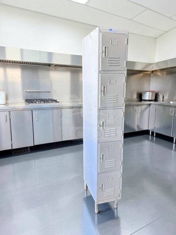 5-tier steel storage locker by GSW Inc., model ELS-5DR. Well-maintained, fully inspected, in a commercial kitchen setting.