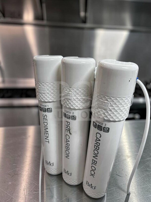 Set of three Brio water filter cartridges: Sediment, Pre-Carbon, Carbon Block, labeled for 3-stage filtration.