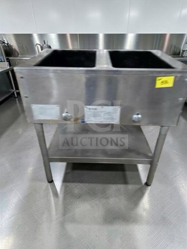 Commercial stainless steel dual well electric hot food table, elite condition, 115V, model STEAM-M-HT-0535, fully tested.