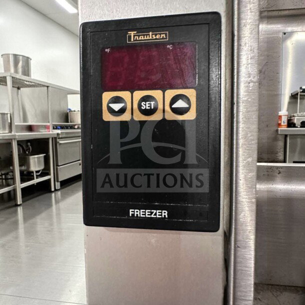 Traulsen G31310 reach-in freezer control panel, showing digital display and buttons. Stainless steel, commercial-grade.