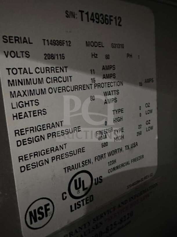 Serial number tag for Traulsen G31310 freezer; 208/115V, 11A total current, UL and NSF listed, made in Fort Worth, TX.