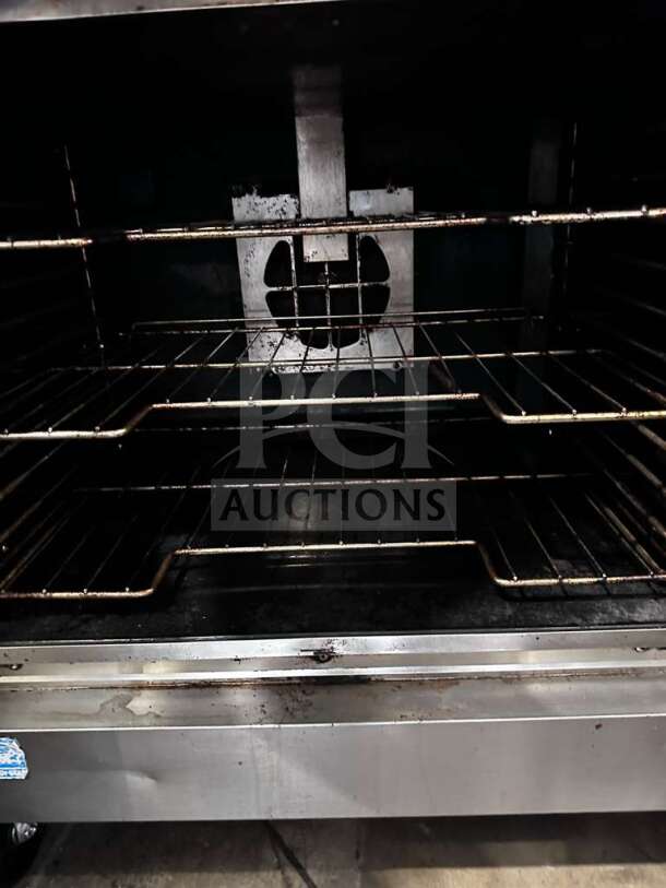 Vulcan VC55GD double stack convection oven, natural gas, heavy-duty, in exceptional condition with casters. Fully operational.