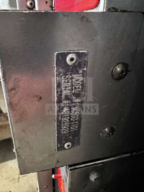 Metal label on Vulcan VC55GD convection oven, showing model and serial numbers. Rugged construction, indicative of heavy-duty use.