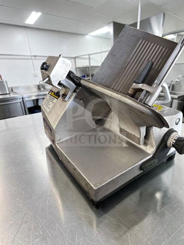 German Knife GS-12M 12" gravity feed manual slicer, 1/2 HP, stainless steel, fully tested, operational, top-tier condition.