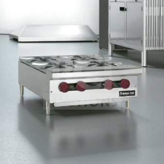 Brand new Therma-Tek TCHP24-4L countertop gas hot plate, featuring four burners. Factory sealed, ready for immediate use.