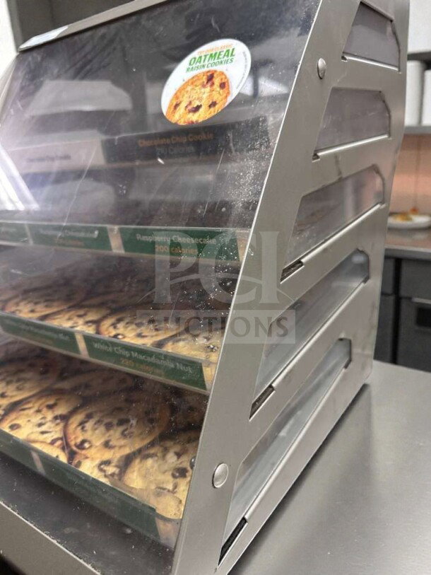 Commercial Countertop Multi-Tier Bakery Display Case in exceptional condition, labeled with cookie varieties, fully operational.