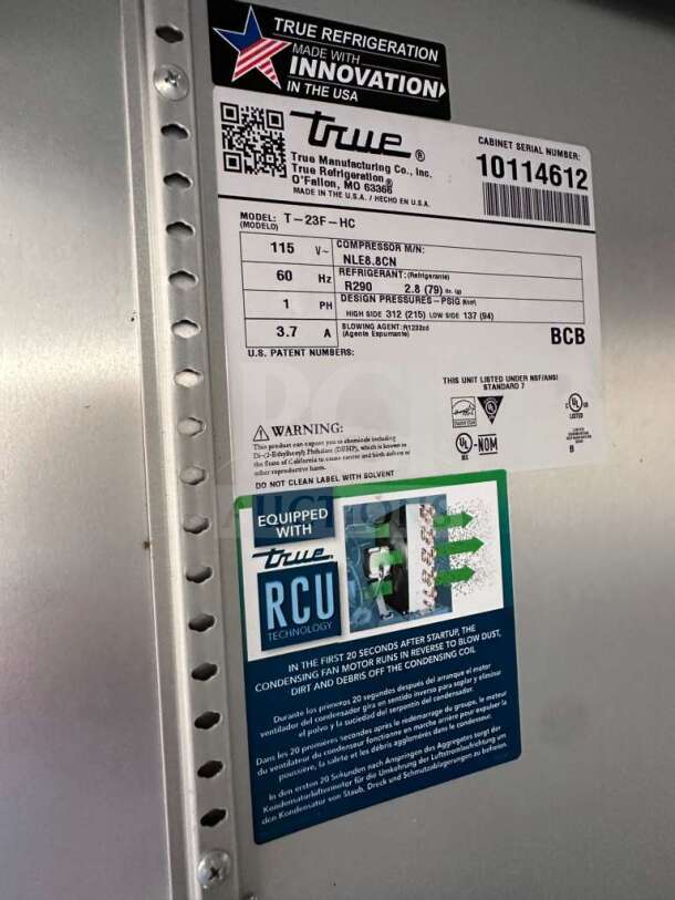 True T-23F-HC commercial freezer label; model info, 115V, stainless steel, 23 cu. ft., fully tested, US-made, RCU technology.
