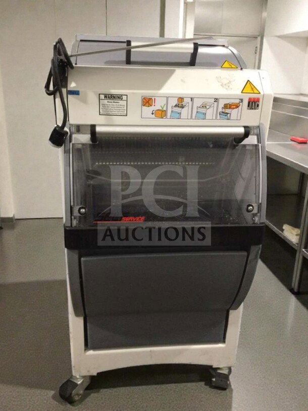 JAC KG-12FS commercial bread slicer, refined condition, 115V, single phase, tested working. Safety warnings and JAC logo visible.