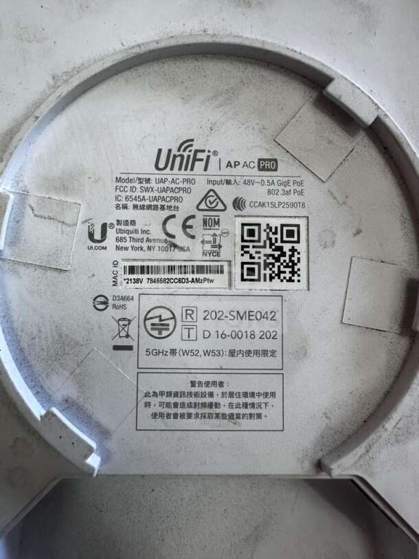 Ubiquiti UniFi UAP-AC-PRO access point label, showing model, FCC ID, input specs, and certification markings.