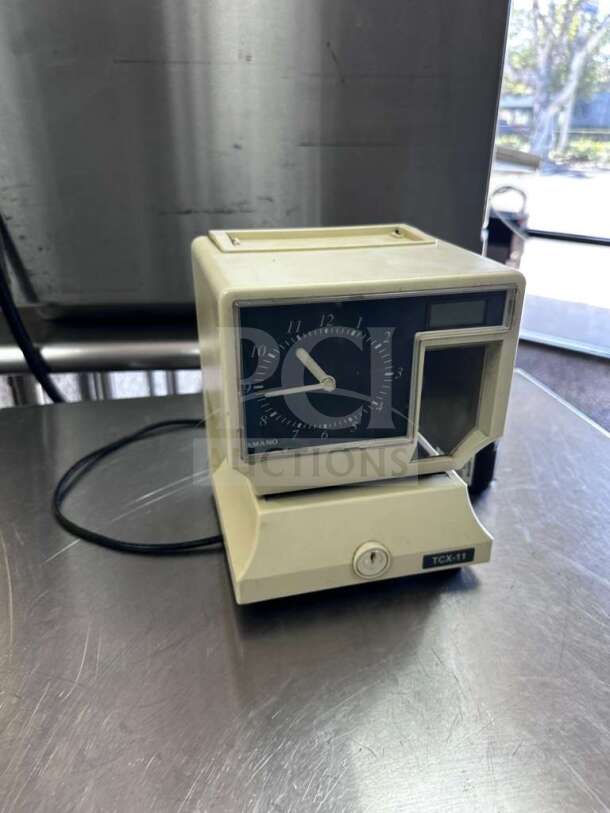 AMANO TCX-11 time clock recorder, model 5477, in prime condition. Fully tested, automatic time stamp machine.