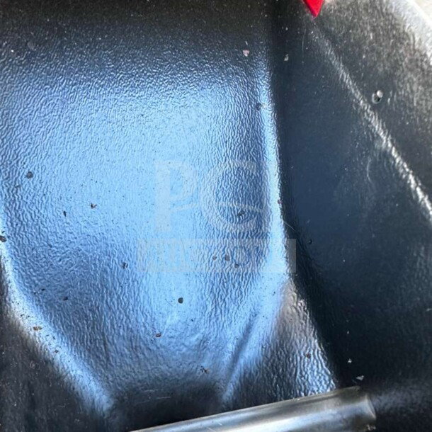 Close-up of the interior of a Bunn G3 HD coffee grinder, showing the clean, textured metal surface.