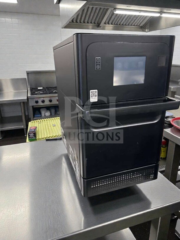 Merrychef Commercial High-Speed Oven, touchscreen control, model MER-L-OVN-0368, in top-tier condition on stainless steel table.