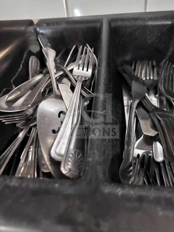 Commercial stainless steel flatware lot, mixed pattern, including forks and spoons in exceptional condition, bulk set.