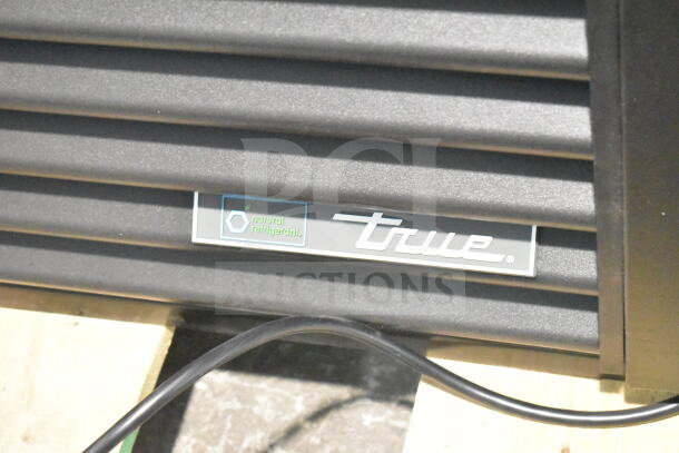 Brand new 2026 True TVM-48SL-HC cooler, scratch and dent, 115V, 1 phase. Features "natural refrigerant" label.