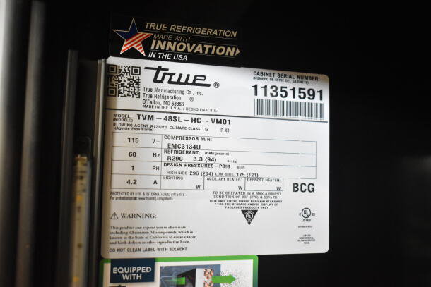 Label on the 2026 True TVM-48SL-HC Commercial 2 Door Cooler, 115V, 1 Phase, features model and serial number.