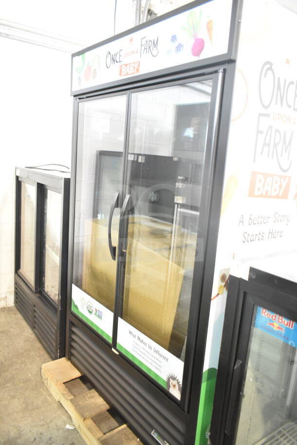 BRAND NEW 2026 True TVM-48SL-HC cooler, commercial 2-door, 115V, scratch and dent, merchandiser graphic visible.