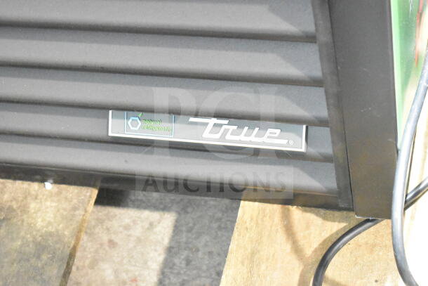 Brand new True TVM-48SL-HC cooler, natural refrigerant label visible, 115V, 1 phase, scratch and dent condition.