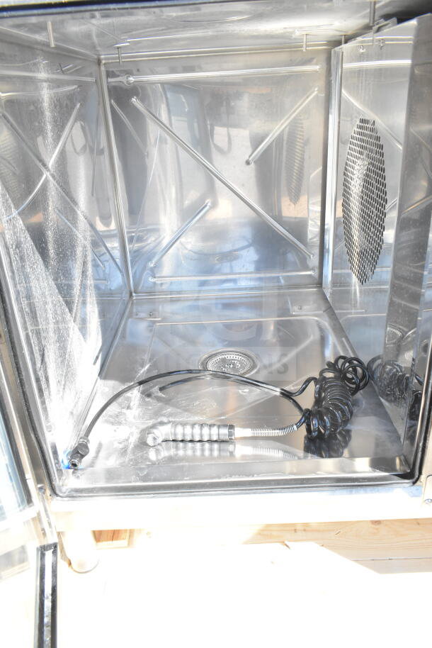 Brand new Blodgett Invoq Hybrid 6-1/1 GN electric combi convection oven interior, showing clean stainless steel finish.